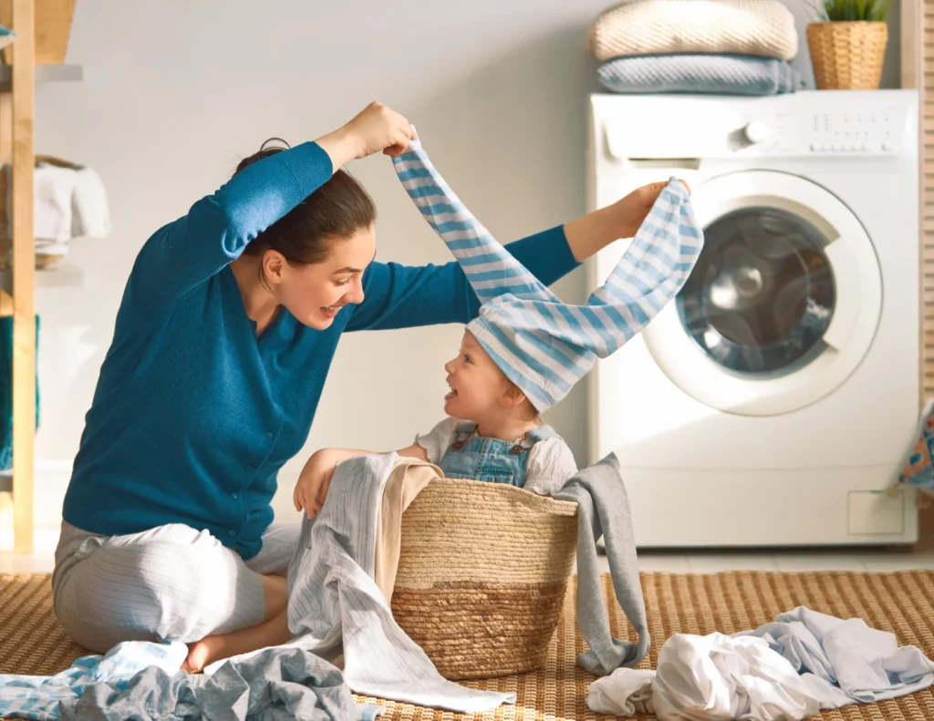 Mother cleaning baby clothes before cleaning